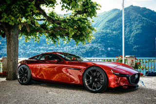Red sports car hillside lake - the background free wallpaper