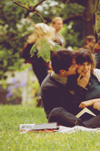 Couple sitting grass field tree - free love wallpaper