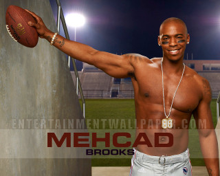 Man holding football smiling stadium - a football free wallpaper