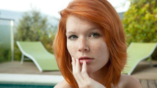 Freckled woman poolside lounge chairs - hair free wallpaper