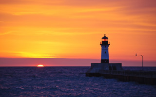Lighthouse pier sunset water background - the background and a body of water free wallpaper