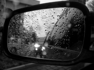 Rear mirror rain drops building - a building in the background free wallpaper