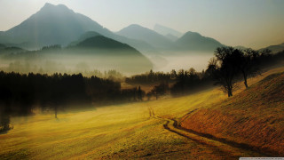 Grassy field dirt path mountains - a grassy field free wallpaper