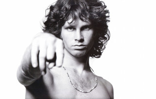 Man pointing camera shirt necklace - free portrait wallpaper