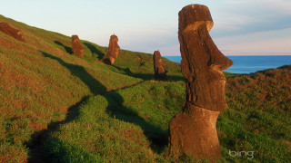Carved rocks hillside ocean blue - ecological art free wallpaper