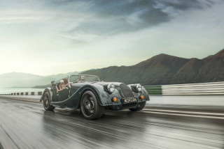 Vintage car driving road mountains - a vintage car free wallpaper