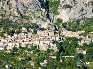 Village nestled mountains trees background - tilt shift free wallpaper