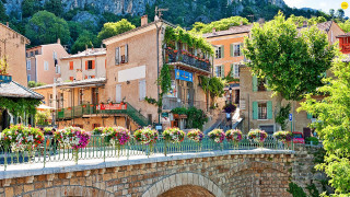 Bridge flowers building mountain trees - a building in the background free wallpaper