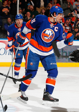 Hockey player ice stick crowd - his hand and a crowd free wallpaper