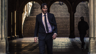 Man suit tie walking hallway - a person in the background free wallpaper