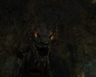Demonic creature glowing eyes cave 2 - a demonic looking creature free wallpaper
