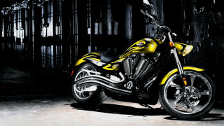 Yellow motorcycle dark room cage - a yellow motorcycle free wallpaper