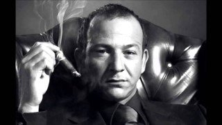 Man suit smoking cigarette holding 2 - david lazar free wallpaper