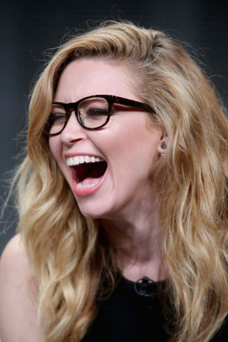 Woman laughing glasses blonde jewelry - a face free wallpaper