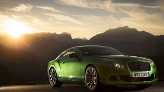 Green car parked road mountains - the sun shining free wallpaper