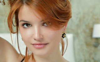 Woman red hair black dress 6 - a white wall behind her free wallpaper