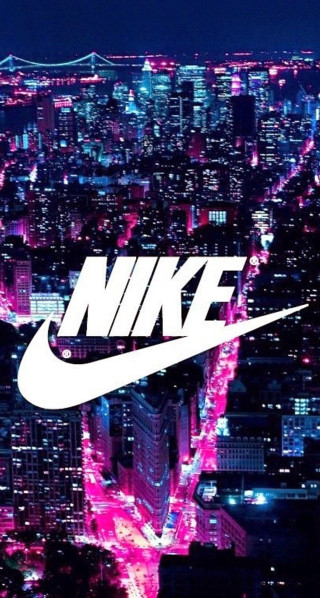 City skyline nike logo night - a city skyline in the background free wallpaper