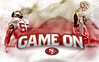 Football player catching ball game - a football player free wallpaper