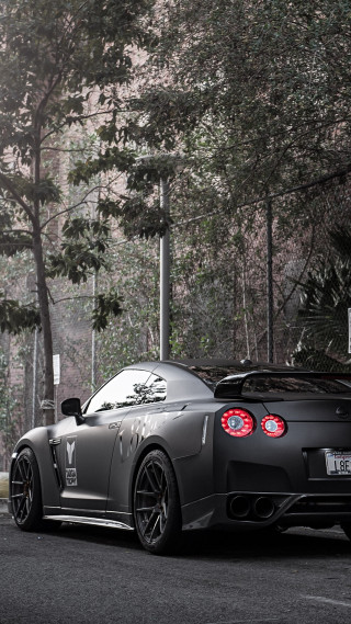 Black sports car tree lined - near free wallpaper