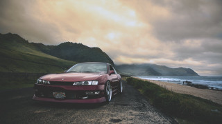 Red car parked ocean mountains 2 - scenery free wallpaper