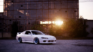 White car parked building sun - andrew bell free wallpaper