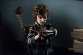 Young boy holding knife wooden - a blue wall free wallpaper