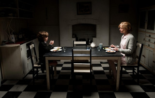 Woman child eating food dark - a table eating food free wallpaper