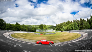 Red car curvy road trees - tree and a hill in the background free wallpaper