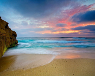 Beach rock formation water colorful - a colorful sky in the background free wallpaper