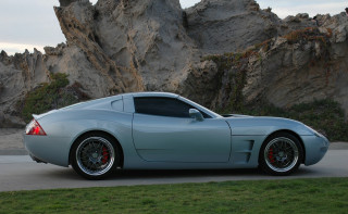 Silver sports car rock formation - matte finish free wallpaper