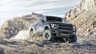 Truck driving rocky terrain mountain - a mountain in the background and a sky background free wallpaper