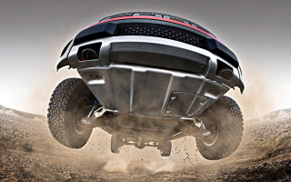 Large truck jumping dirt road - daren bader free wallpaper