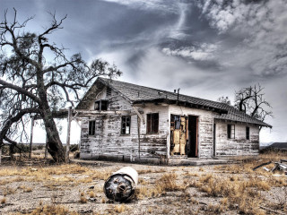 Run down house barrel tree - a cloudy sky free wallpaper