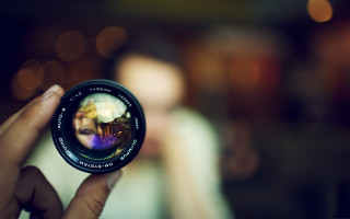 Person holding camera lens blurry 3 - a person holding free wallpaper