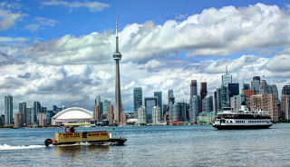 Boat city skyline tall tower - the water near a city skyline free wallpaper
