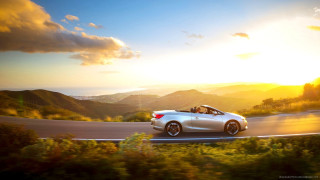 Car driving road sunset hills - cinematic photography free wallpaper