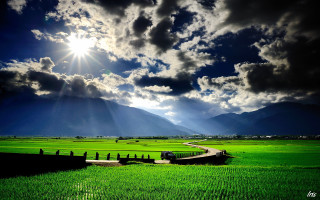 Green field road mountain range - a sunbeam free wallpaper