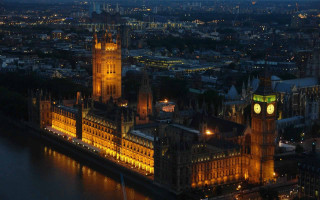 Large building clock tower night 2 - night time in a city free wallpaper