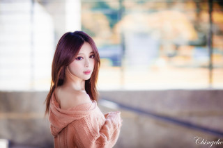 Woman red hair sweater city - a building in the background free wallpaper