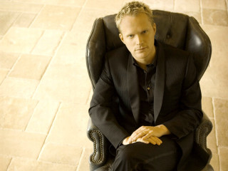 Man suit chair looking up - andrew bell free wallpaper