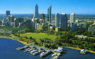 City lake boats skyline blue - free city wallpaper