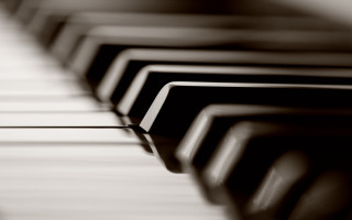 Piano keys closeup blurry background - cinematic composition free wallpaper