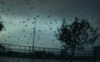 Rain covered window street light 2 - a cloudy sky free wallpaper