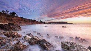 Rocky beach sunset pink sky 3 - rich moody colour free wallpaper