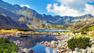 Lake mountains rocks blue sky - boleslaw cybi free wallpaper