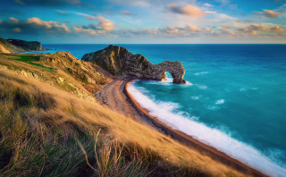 Beach rock formation sunset landscape - sandy free wallpaper
