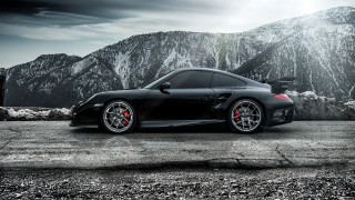 Black sports car mountain range - moody free wallpaper