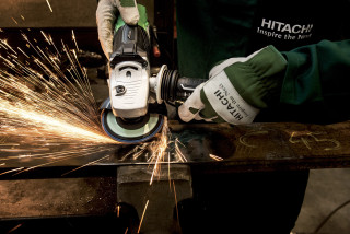 Person grinding metal sparks gloves - autodestructive art free wallpaper