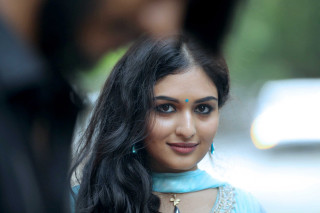 Woman blue blouse necklace man - movie still frame free wallpaper