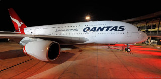 Airplane parked airport night lights - the side of the plane free wallpaper